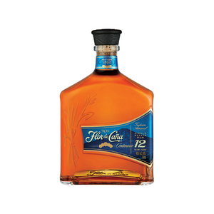 a bottle of Flor de Caña 12 years Centenario with its vlue label